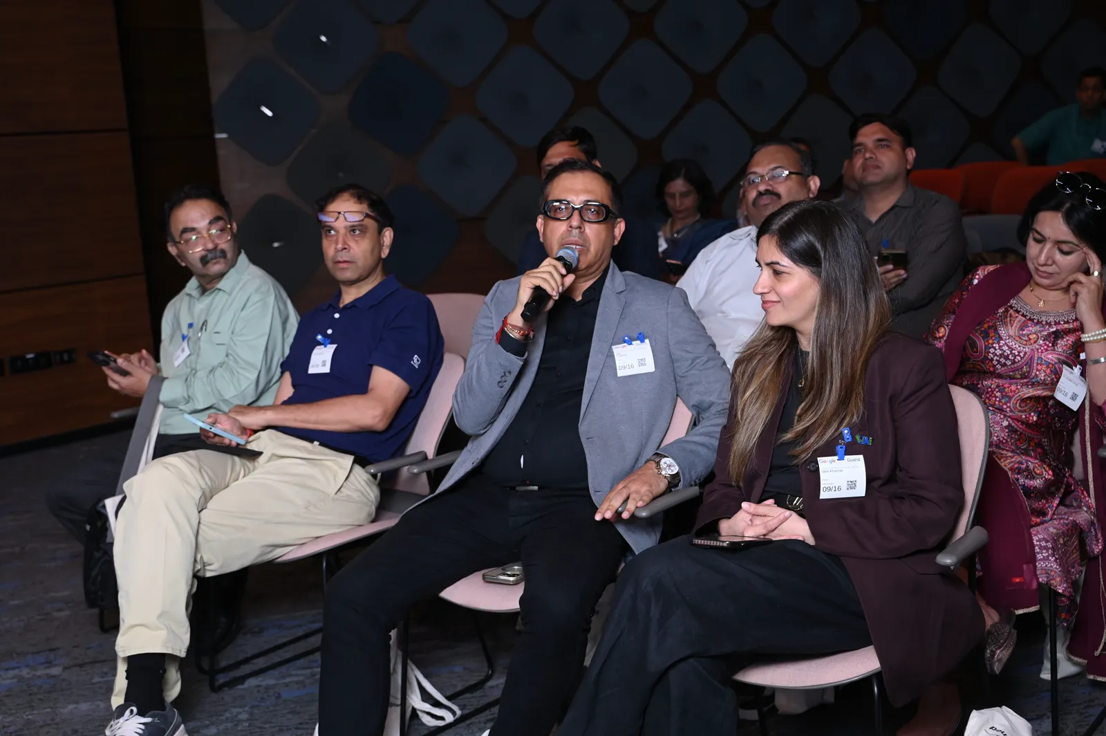 Panel of placement and academic heads with microphones on stage